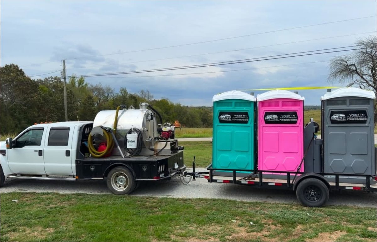 West TN Pump Works truck and trailer carrying three restrooms